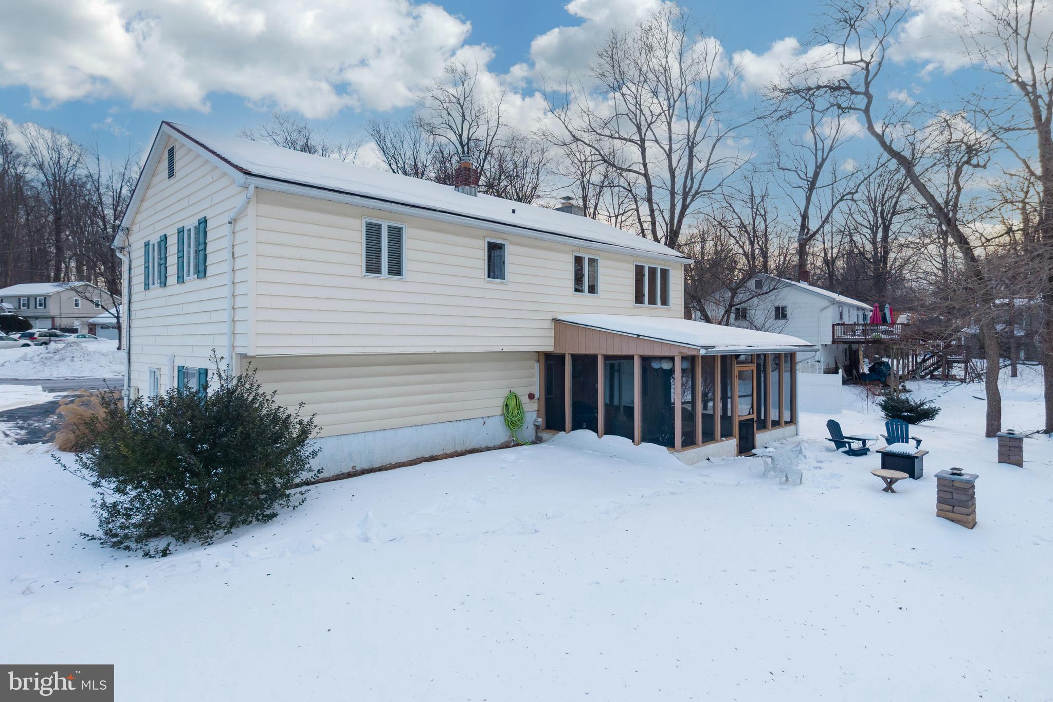 305 Concord Avenue Exton, PA 19341 - Photo 32 of 38 a view of a house with a yard covered with snow in front of house