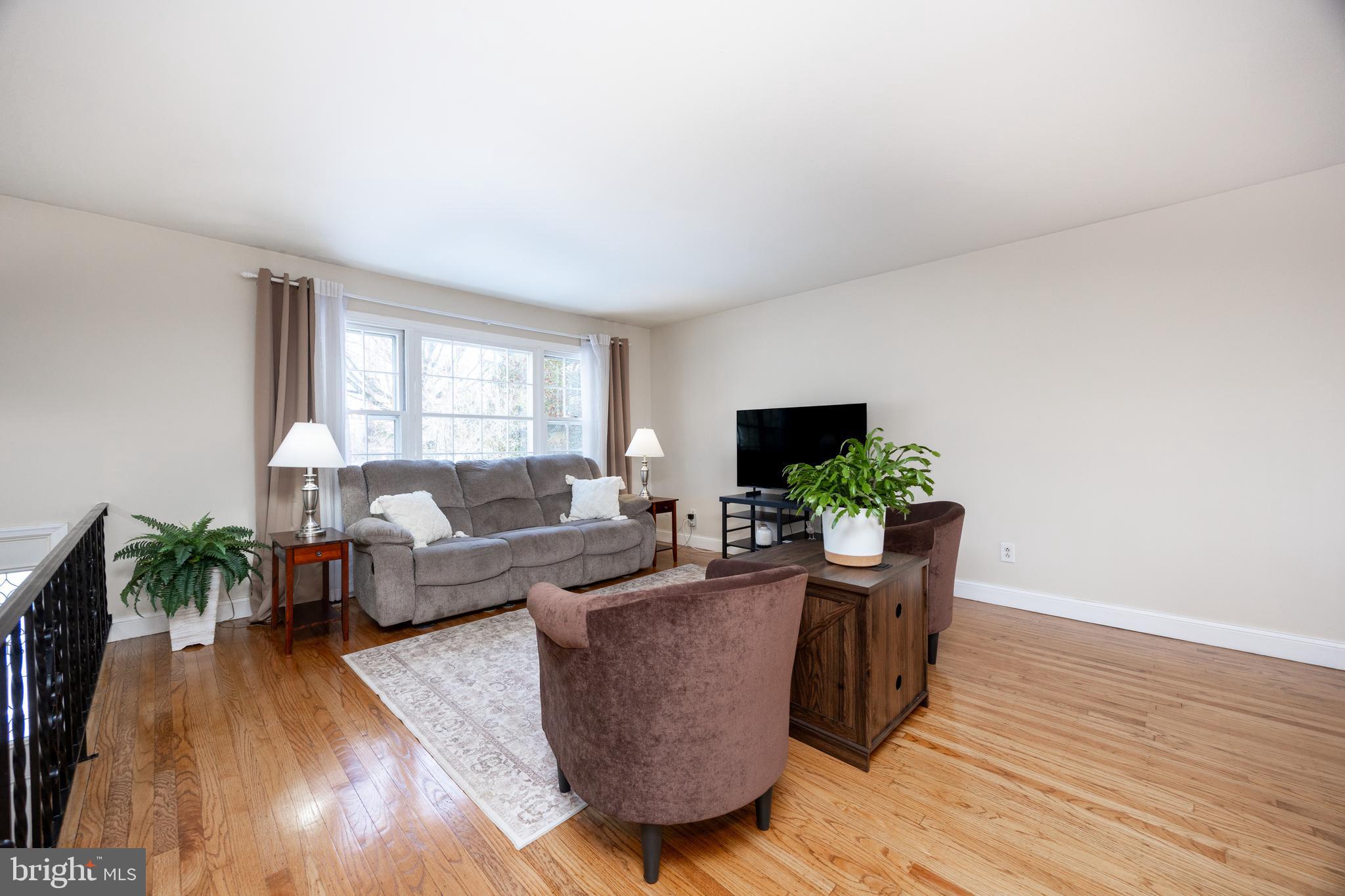 305 Concord Avenue Exton, PA 19341 - Photo 7 of 38 a living room with furniture and a flat screen tv