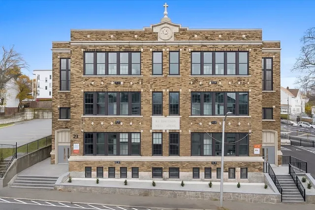 a front view of a building with windows