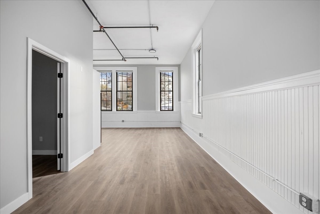 22 Waverly Street Worcester, MA 01604 - Photo 12 of 41 a view of an empty room with wooden floor and a window