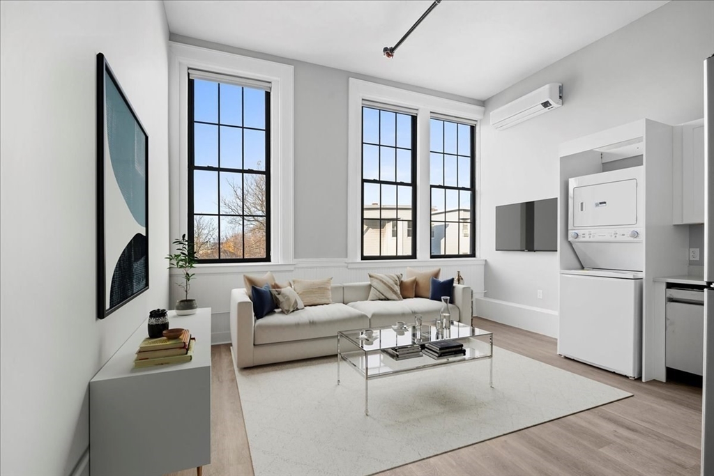 22 Waverly Street Worcester, MA 01604 - Photo 20 of 41 a living room with furniture wooden floor and large window