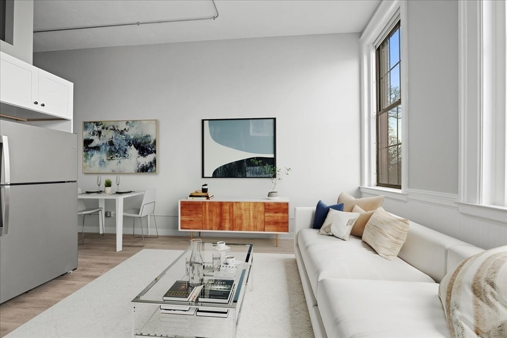 22 Waverly Street Worcester, MA 01604 - Photo 21 of 41 a living room with furniture and a window