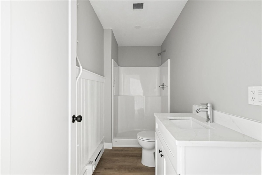 22 Waverly Street Worcester, MA 01604 - Photo 22 of 41 a bathroom with a sink a toilet and shower