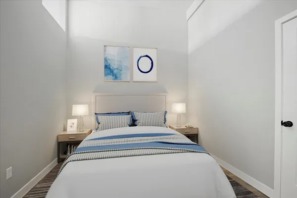 a bed room with a bed and a window