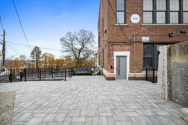 a view of a building with a yard