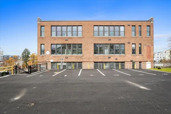 a front view of a building with many windows