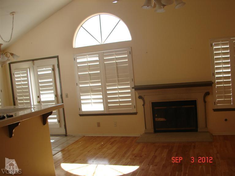 430 Innwood Road Simi Valley, CA 93065 - Photo 3 of 4 a view of an empty room with a fireplace and a window