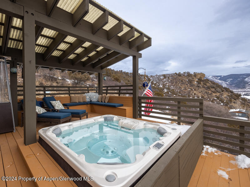 1711 Juniper Hill Road Aspen, CO 81611 - Photo 15 of 19 a view of a swimming pool with a patio