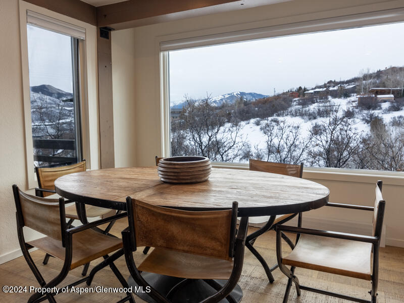 1711 Juniper Hill Road Aspen, CO 81611 - Photo 6 of 19 a view of a dining room with furniture window and outside view