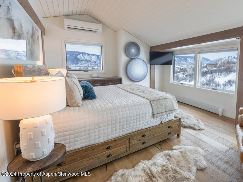 1711 Juniper Hill Road Aspen, CO 81611 - Photo 8 of 19 a bedroom with a bed and window