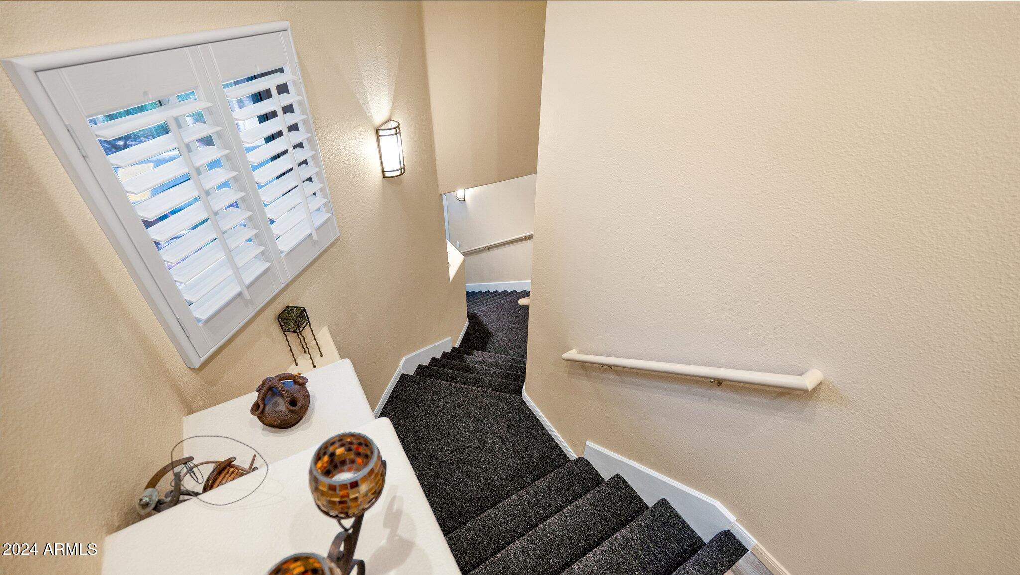 8245 East Bell Road, Unit 207 Scottsdale, AZ 85260 - Photo 25 of 33 view of a room with rug and white walls