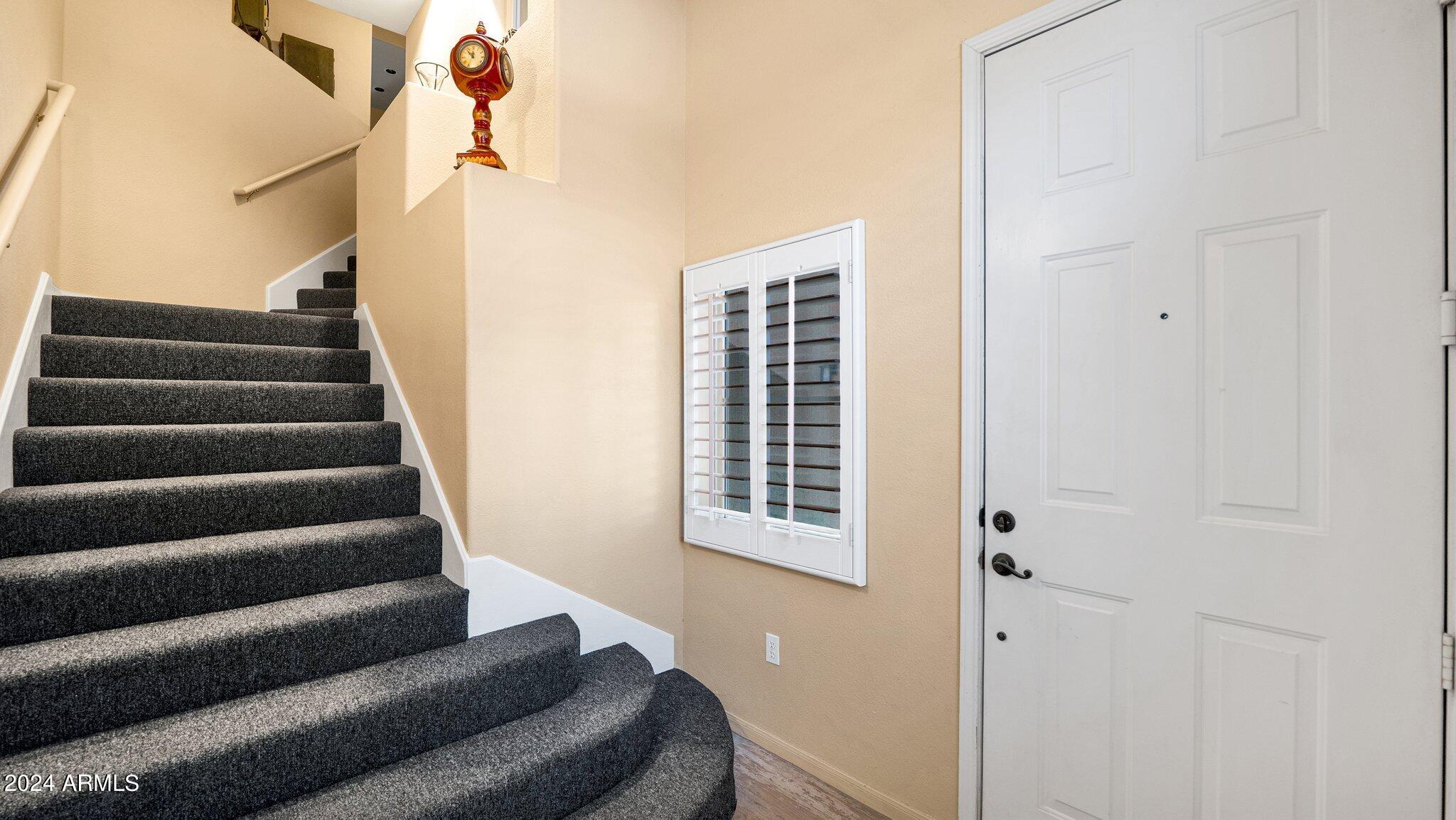 8245 East Bell Road, Unit 207 Scottsdale, AZ 85260 - Photo 3 of 33 a view of entryway with wooden floor