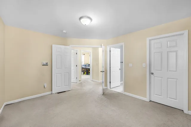 a bedroom with bed and a window