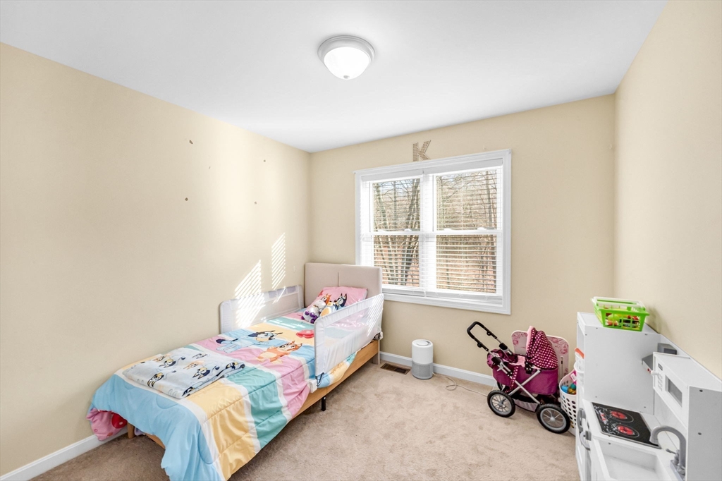 114 Riverton Road Springfield, MA 01109 - Photo 13 of 33 a bedroom with bed and a window