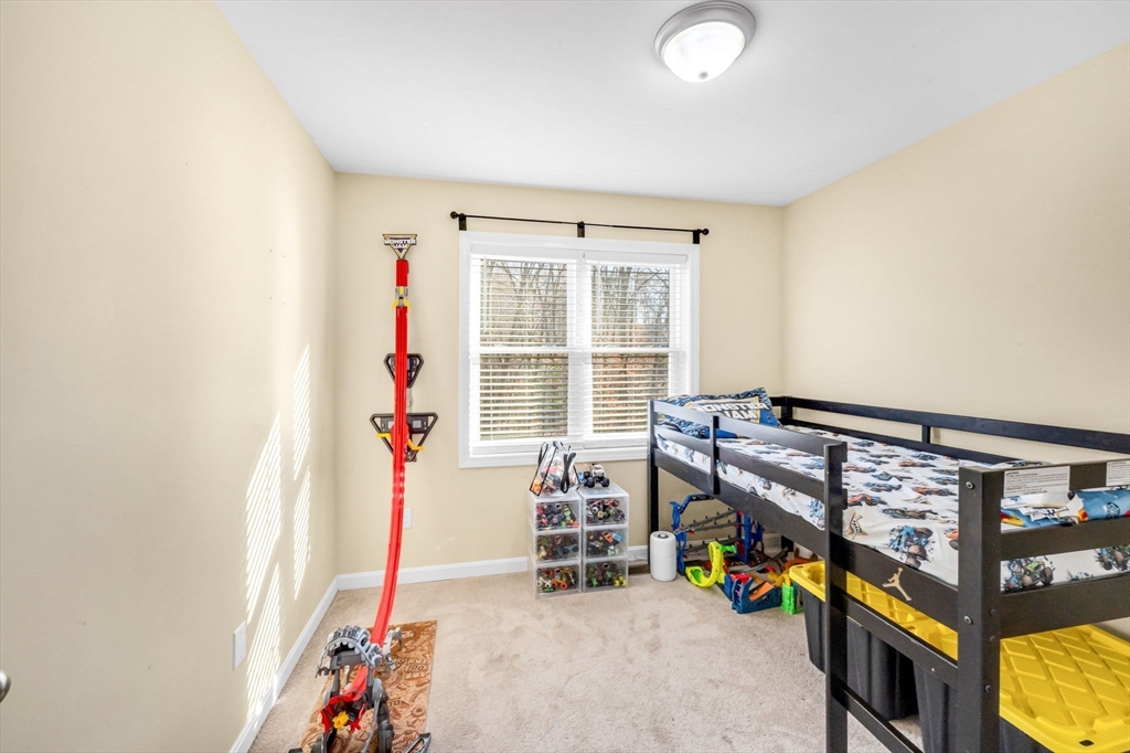 114 Riverton Road Springfield, MA 01109 - Photo 14 of 33 a bedroom with furniture and a window