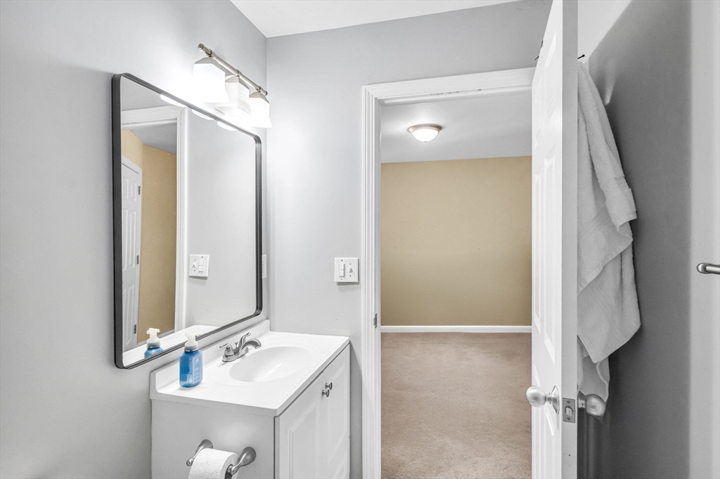 114 Riverton Road Springfield, MA 01109 - Photo 16 of 33 a bathroom with a sink and a mirror