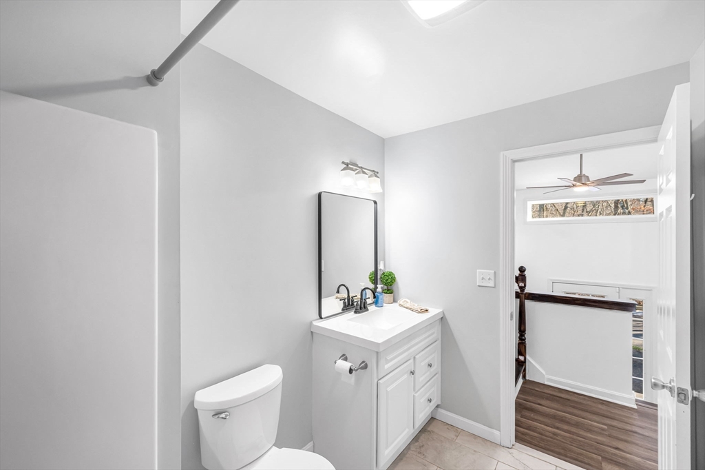 114 Riverton Road Springfield, MA 01109 - Photo 18 of 33 a bathroom with a toilet sink and mirror