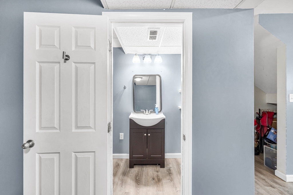 114 Riverton Road Springfield, MA 01109 - Photo 24 of 33 a bathroom with a mirror and a sink