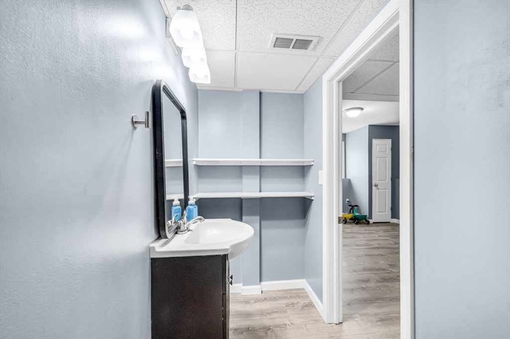 114 Riverton Road Springfield, MA 01109 - Photo 25 of 33 a bathroom with a sink and a mirror