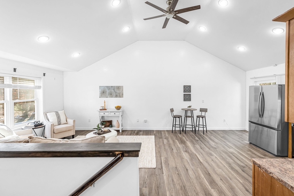114 Riverton Road Springfield, MA 01109 - Photo 3 of 33 a kitchen with a table chairs refrigerator and window