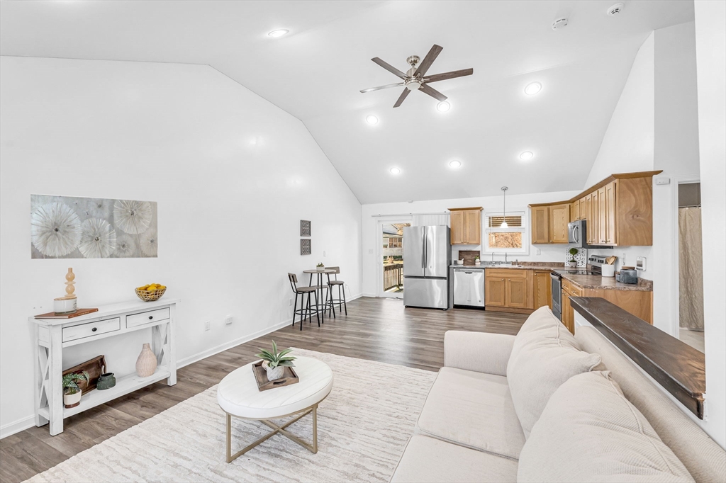 114 Riverton Road Springfield, MA 01109 - Photo 5 of 33 a living room with furniture kitchen view and a chandelier