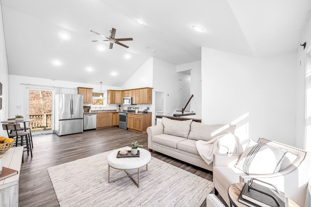 114 Riverton Road Springfield, MA 01109 - Photo 6 of 33 a living room with furniture kitchen view and a wooden floor