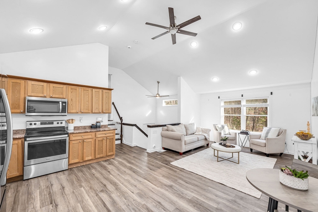 114 Riverton Road Springfield, MA 01109 - Photo 8 of 33 a living room with furniture kitchen and a wooden floor