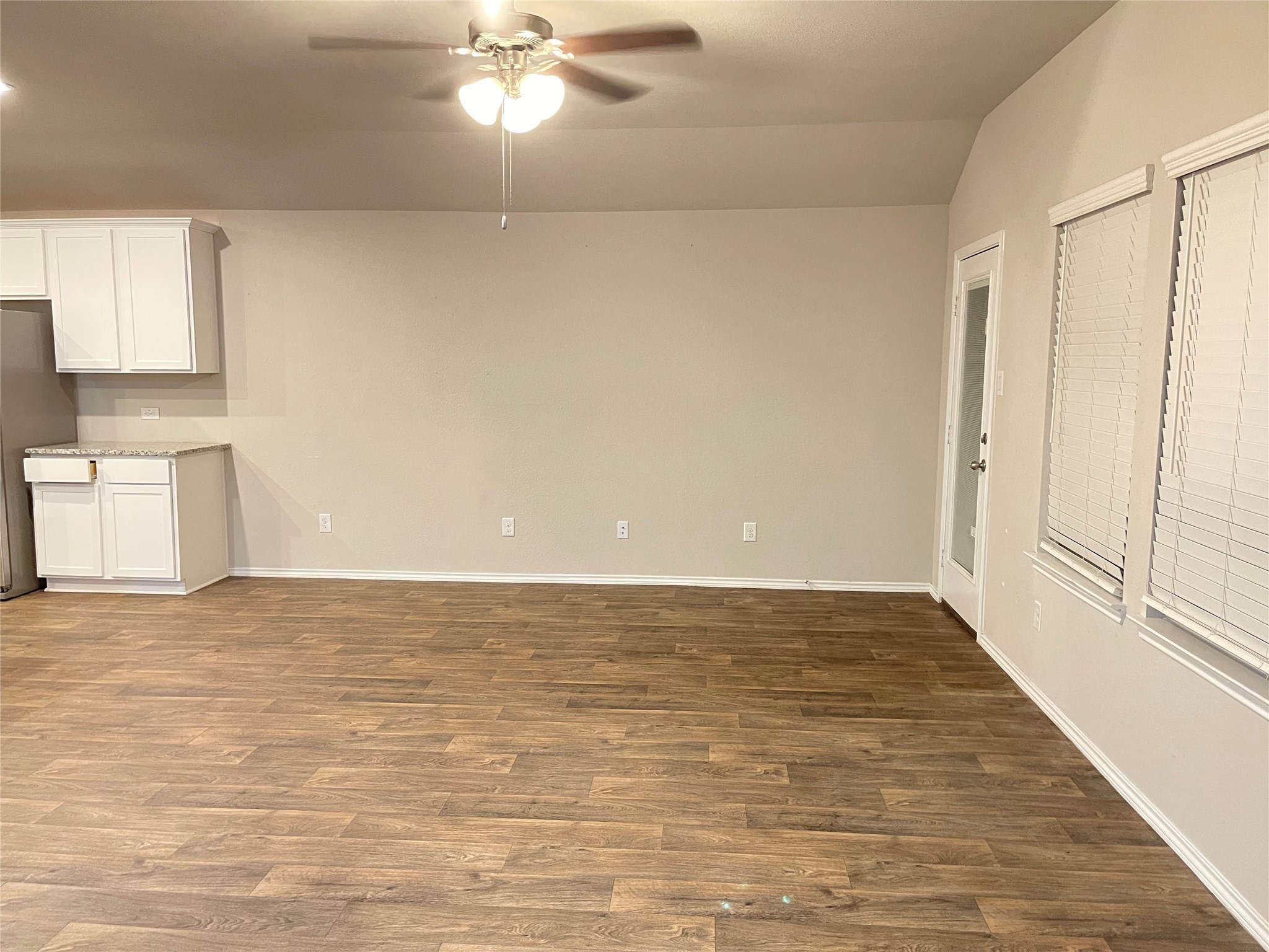 16004 Birch Bay Lane Conroe, TX 77384 - Photo 16 of 24 a view of an empty room with window and wooden floor