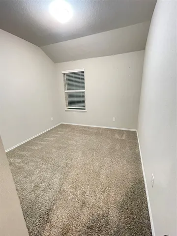 an empty room with closet area