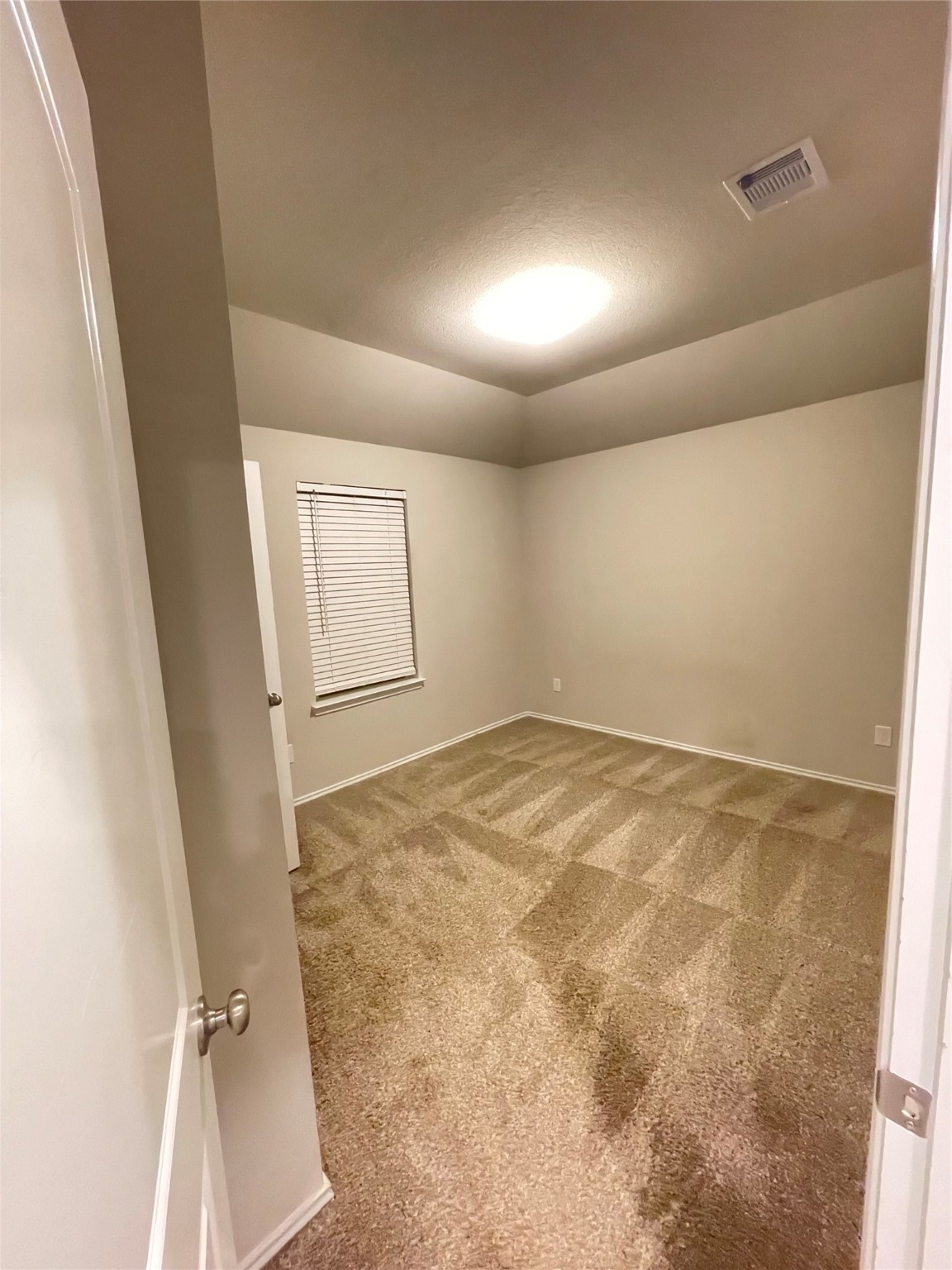16004 Birch Bay Lane Conroe, TX 77384 - Photo 20 of 24 an empty room with a wooden door