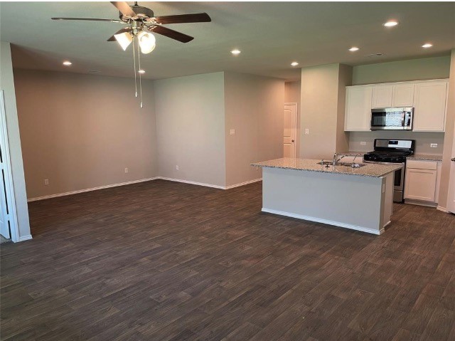 16004 Birch Bay Lane Conroe, TX 77384 - Photo 4 of 24 an empty room with kitchen and view living room