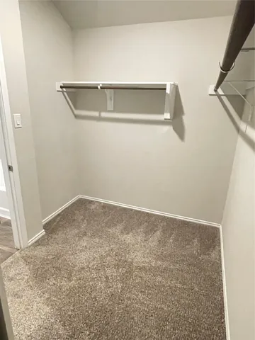 a white bath tub sitting next to a white sink