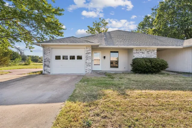 a view of a house with a garden