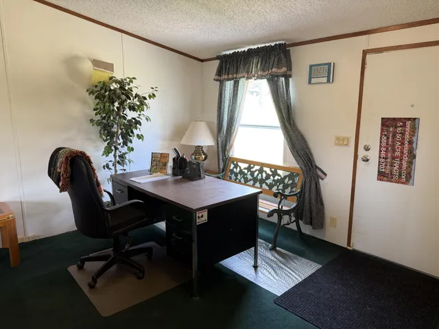 a view of a workspace with furniture