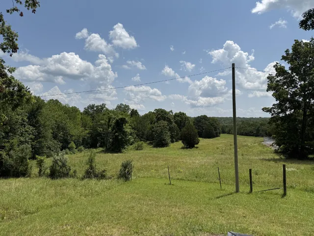 a view of a lake with a yard