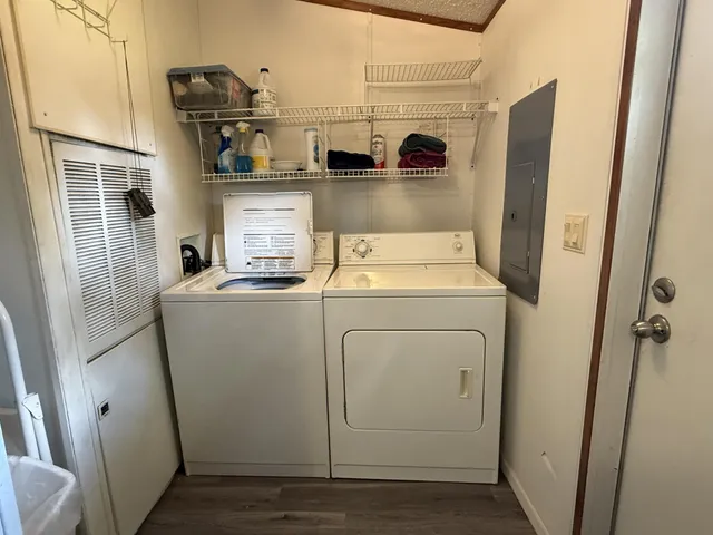 a kitchen with a refrigerator and a stove