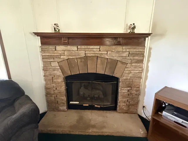 a view of a workspace with furniture and a potted plant