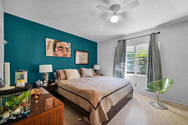 a bathroom with a sink mirror and shower