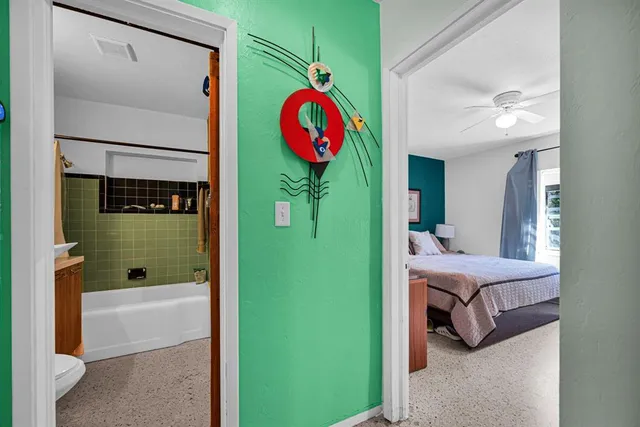 a bedroom with furniture and a rug