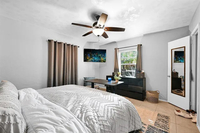 a bedroom with a bed and dresser