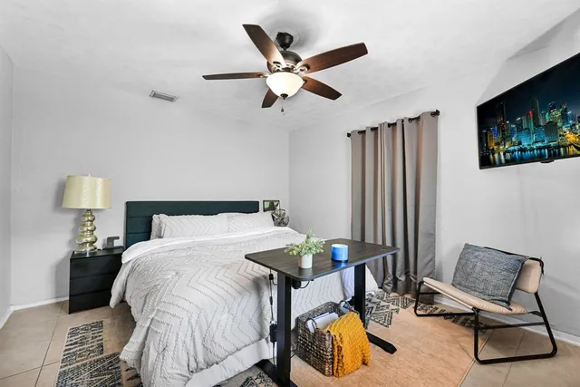 an aerial view of a house with a garden and plants