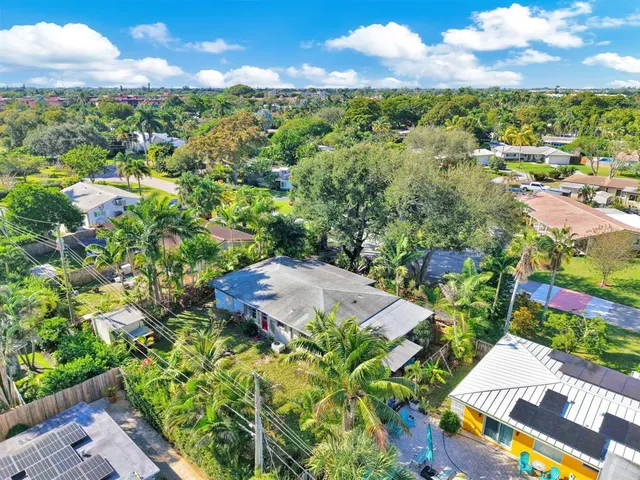 a backyard of a house with outdoor seating