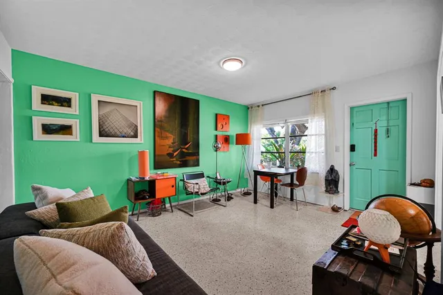 a living room with furniture and a window