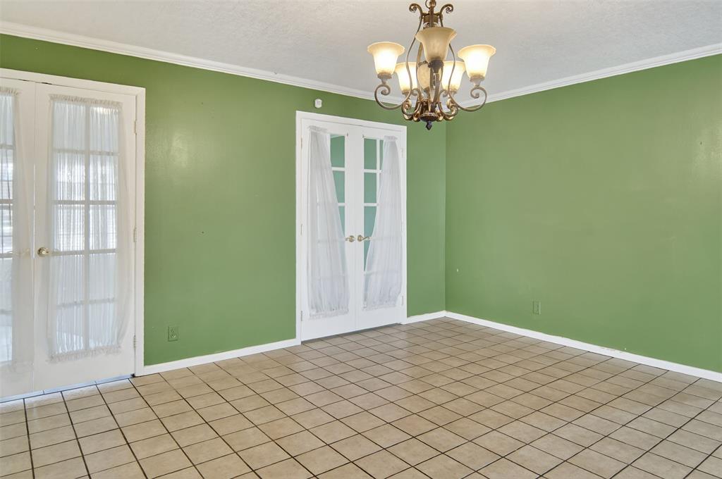 904 Northwest 7th Avenue Mineral Wells, TX 76067 - Photo 9 of 36 Dining area with french doors that open to formal living area