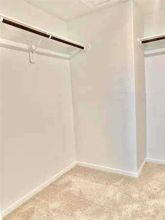 a bathroom with bathtub and window