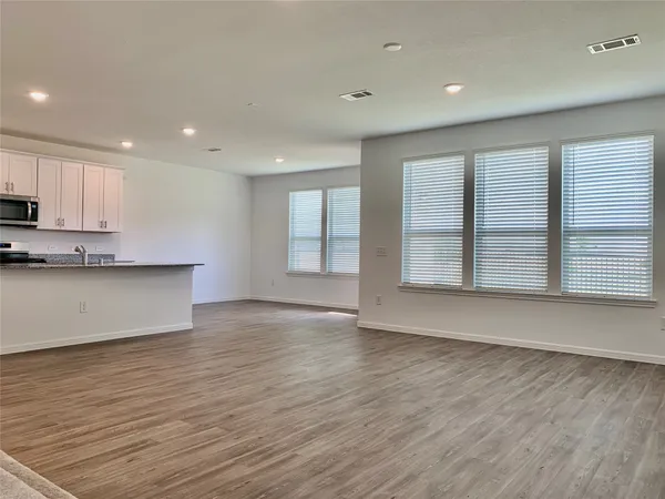 an aerial view of a house with a swimming pool