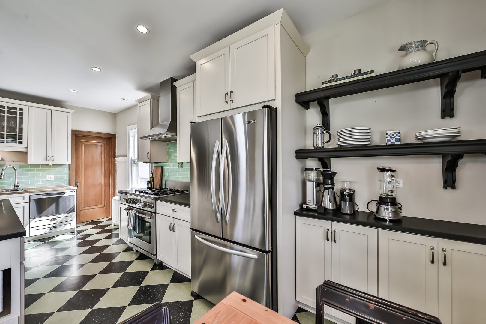 117 Southcote Road Riverside, IL 60546 - Photo 15 of 39 a kitchen with stainless steel appliances granite countertop a refrigerator and a stove top oven