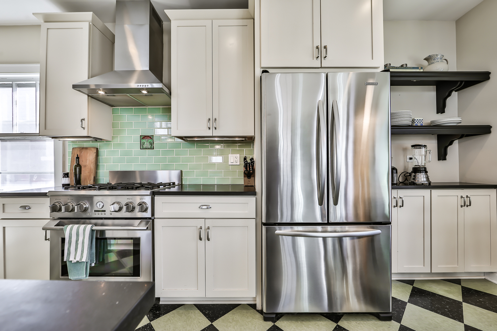 117 Southcote Road Riverside, IL 60546 - Photo 9 of 39 a kitchen with stainless steel appliances granite countertop a stove a refrigerator and a cabinets