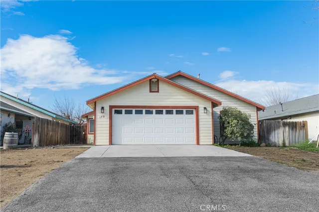 a view of garage and yard