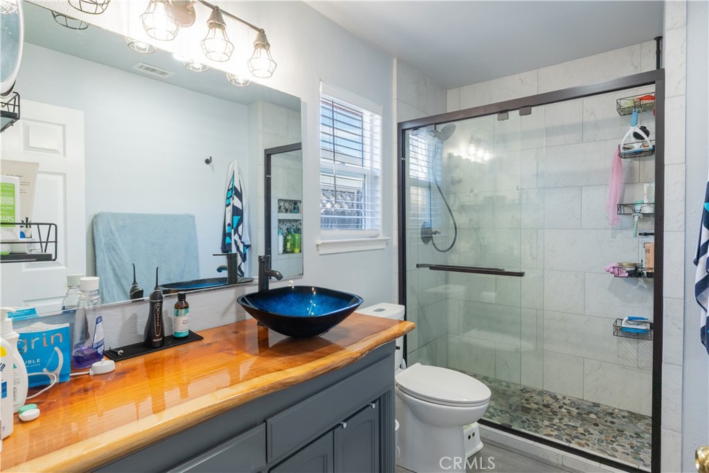 175 South 7th Street Shandon, CA 93461 - Photo 6 of 7 a bathroom with a sink toilet and shower